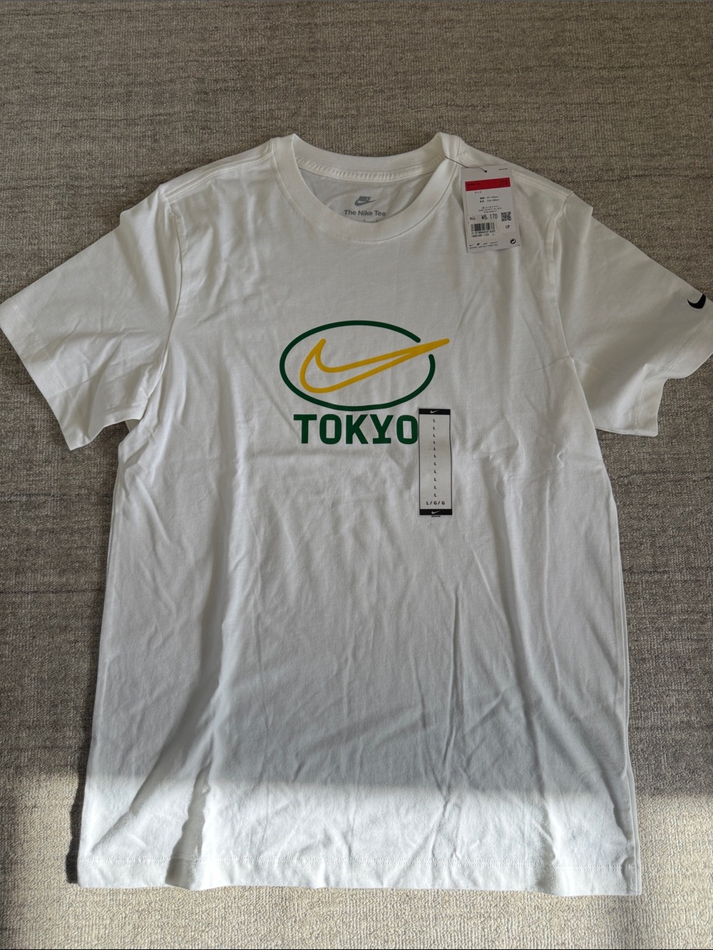 Nike White Tokyo Graphic Short Sleeve Tee with Green & Yellow Logo